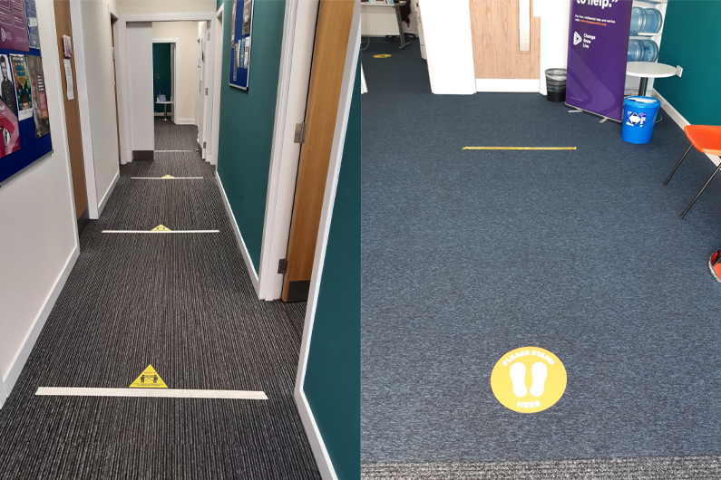 Markers on the floor showing how far apart people need to be